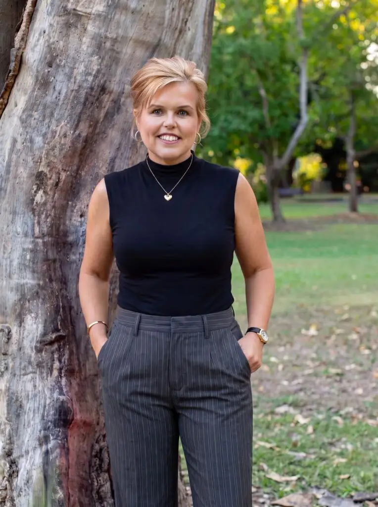 Megan Grant, founder of Plentifor, standing beside a tree in a park