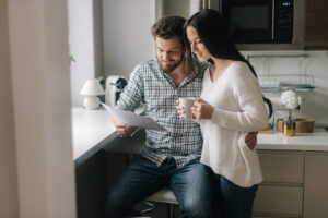 Couple reviewing their budget together at home